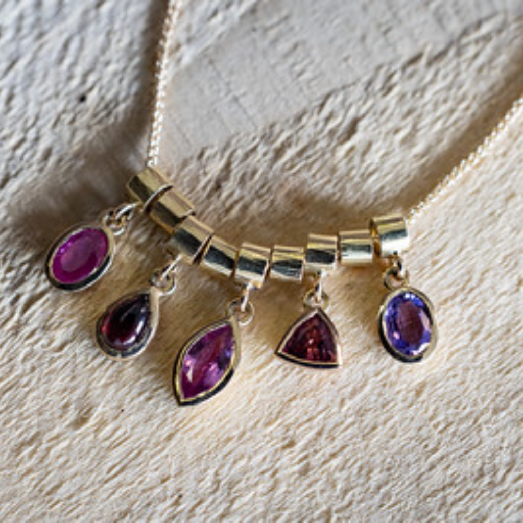 Pendant - stacked ruby, garnet, 3 sapphires in gold settings on gold chain