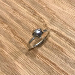 Akoya pearl ring with silver triple setting on silver band