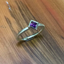Square purple amethyst in silver on silver band