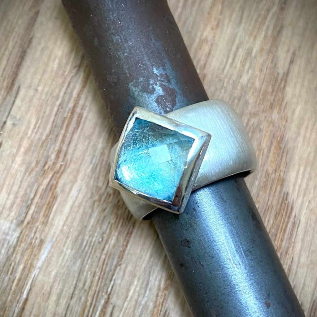 square blue topaz offset silver setting on silver ring