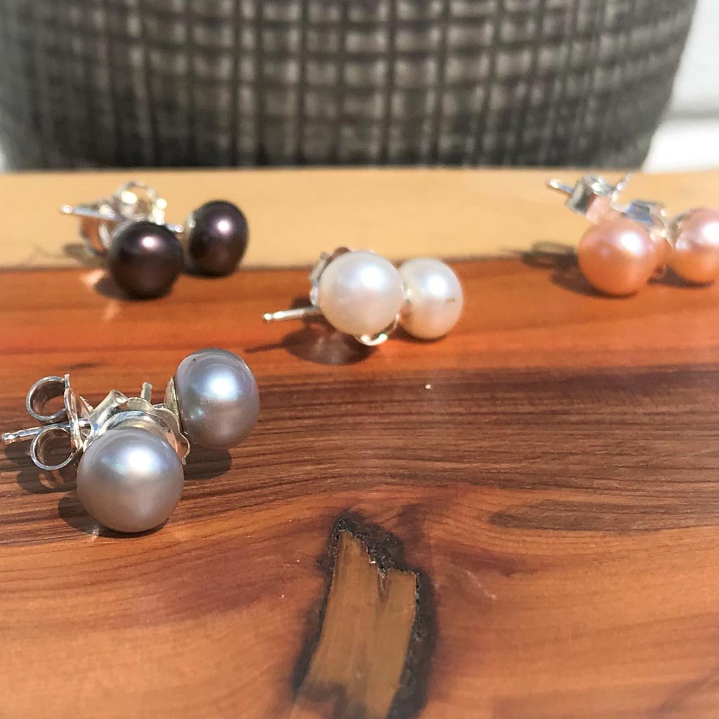 grey button pearl stud in silver, other colours behind