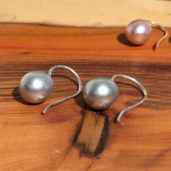 Large grey pearl earrings on gold