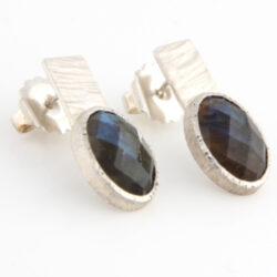 Earring of labradorite cabochon in silver setting on silver back piece