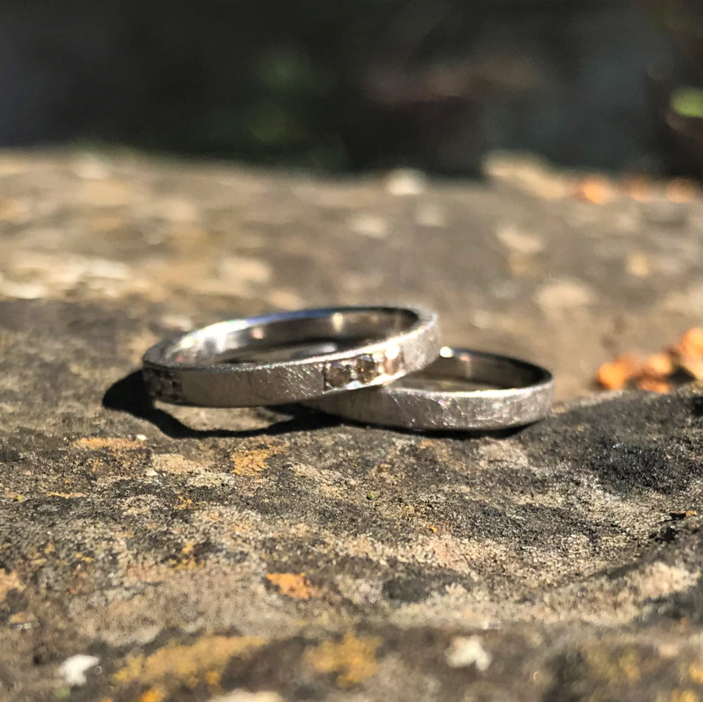 Twelve cinnamon diamond palladium band over plain palladium band