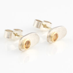 Stud with citrine set in gold on backpiece of silver
