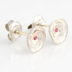 Tiny pink sapphire set in gold within silver rose with gold bar stud